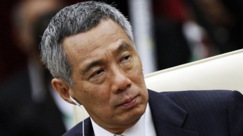 Singapore's PM Lee Hsien Loong attends a session of the 21st ASEAN and East Asia summits in Phnom Penh